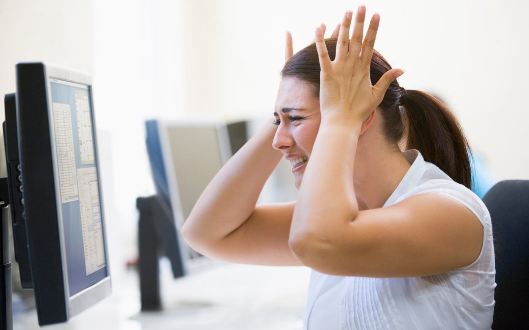 Woman in computer room looking frustrated
