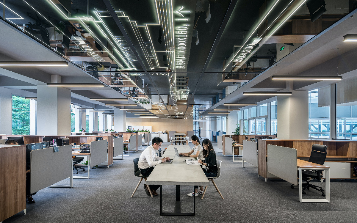 Enterprise business with people, cubicles, tables, digital ceiling