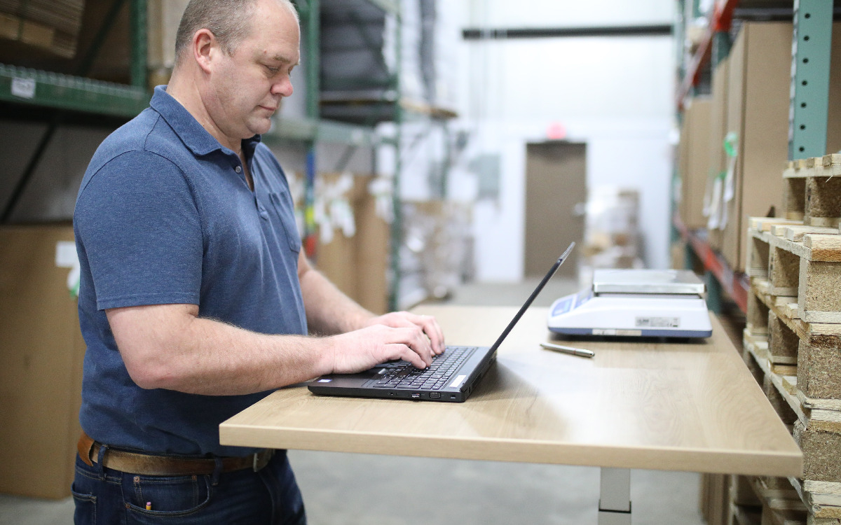 Man using laptop for manufacturing