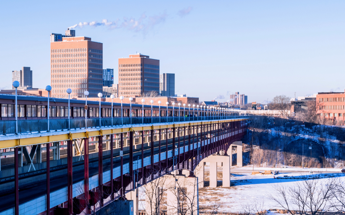 A view of a bridge and buildings at the University of Minnesota.